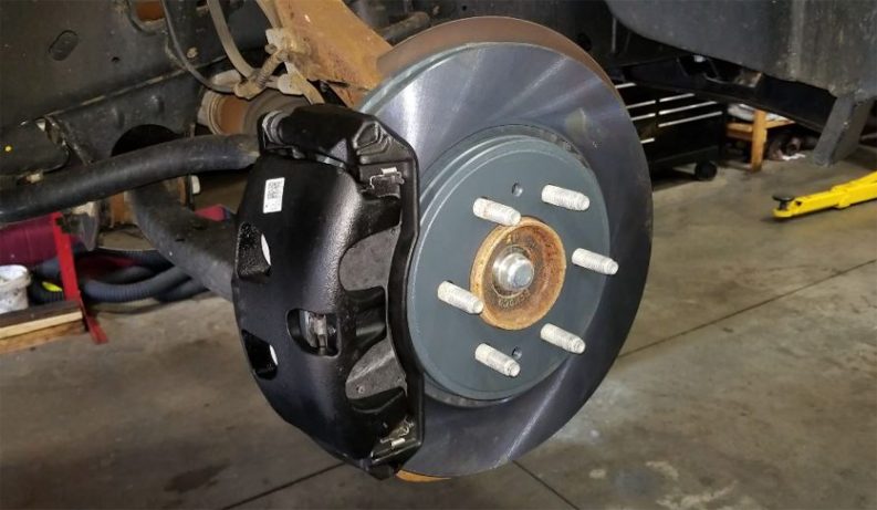 Ford Expedition front brake rotor, brake caliper and brake pads.