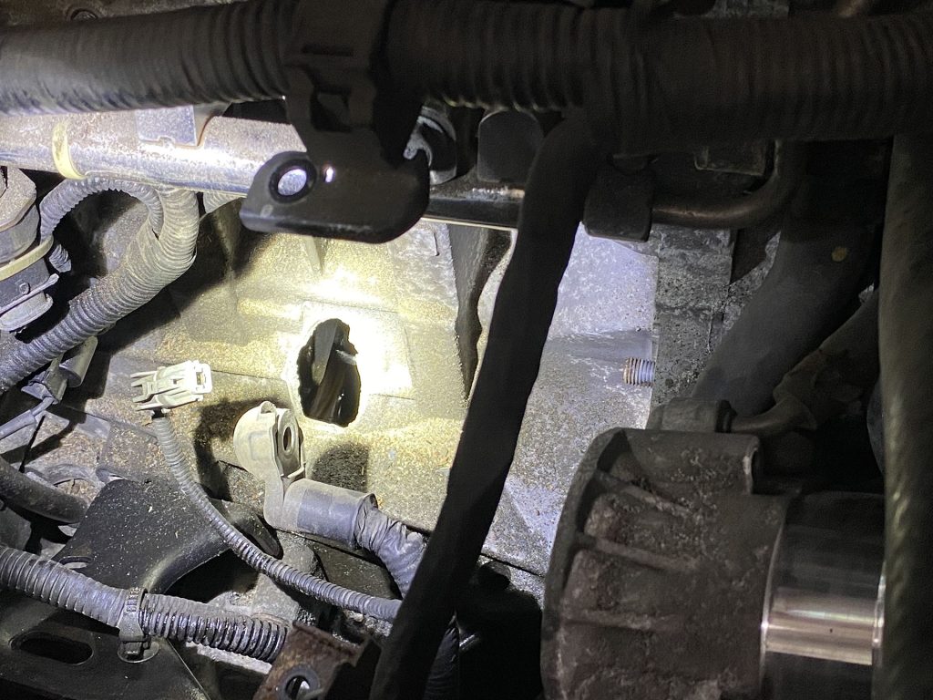 A hole in the engine block of Hyundai Santa Fe.