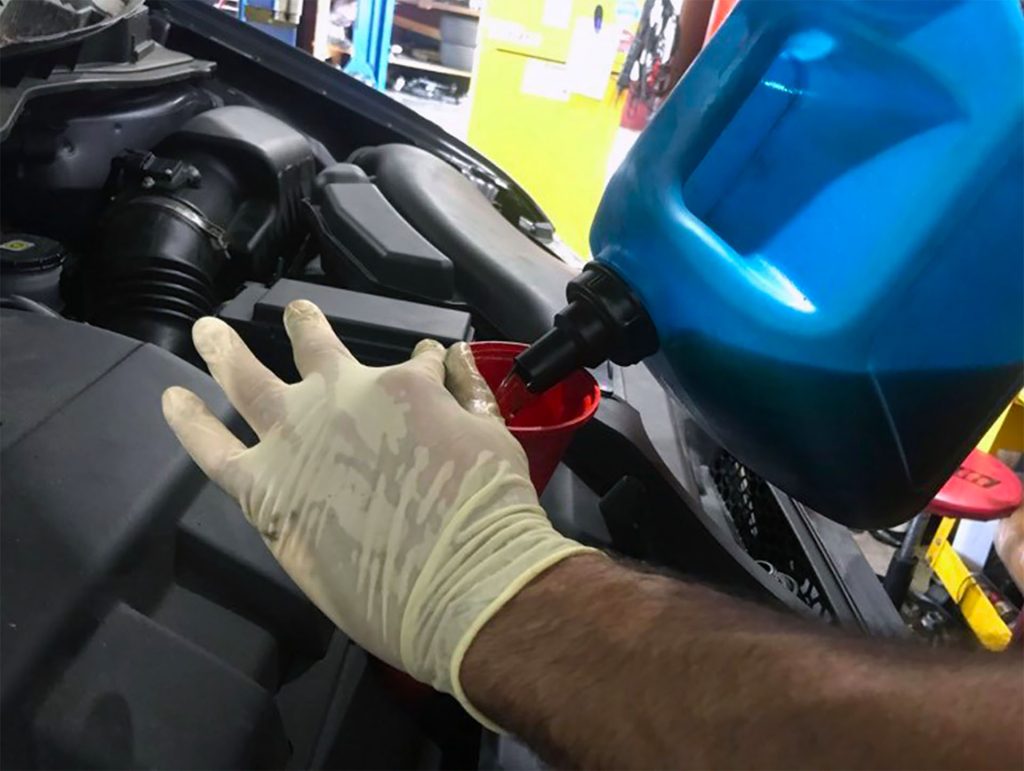 Adding engine cleaner.