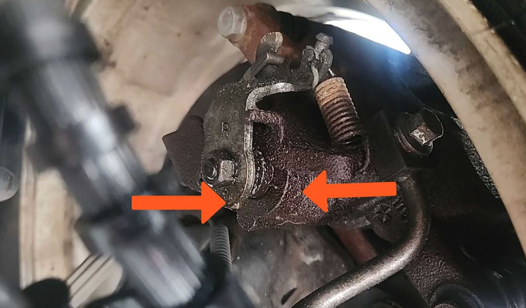 Leaking brake caliper on a Chrysler Town and Country.