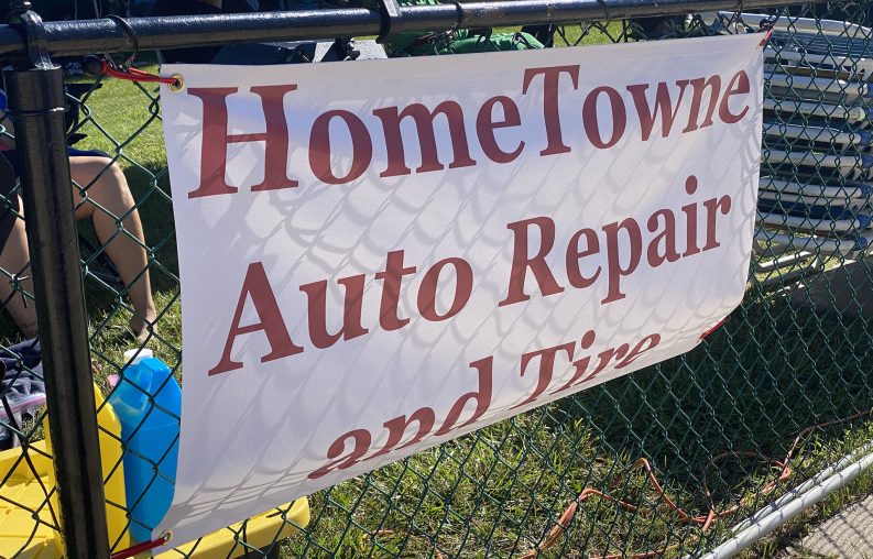 HomeTowne Auto Repair banner at Lake Ridge swim meet.