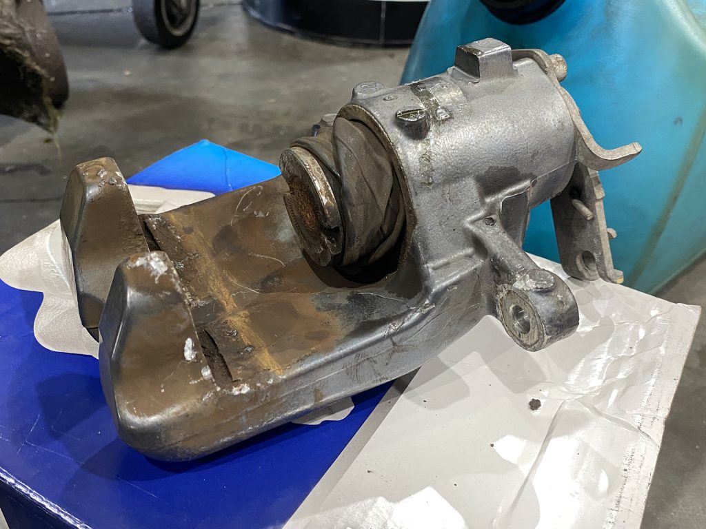 Old brake calipers for a Cadillac XTS.