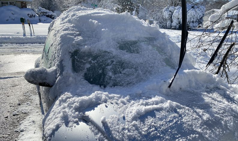 Snow on a Volkswagen Beetle.