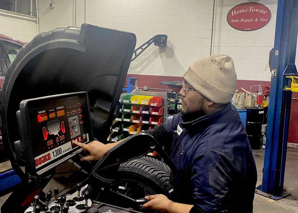 Apprentice Technician performing wheel balance on Michelin CrossClimate 2 Tire.