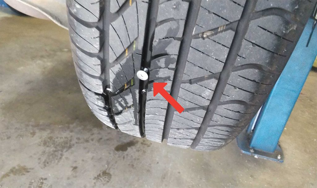 Tire repair on Ford Focus.