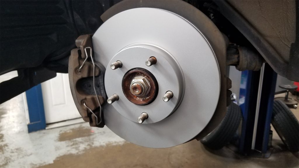 Front disc brake caliper hardware.