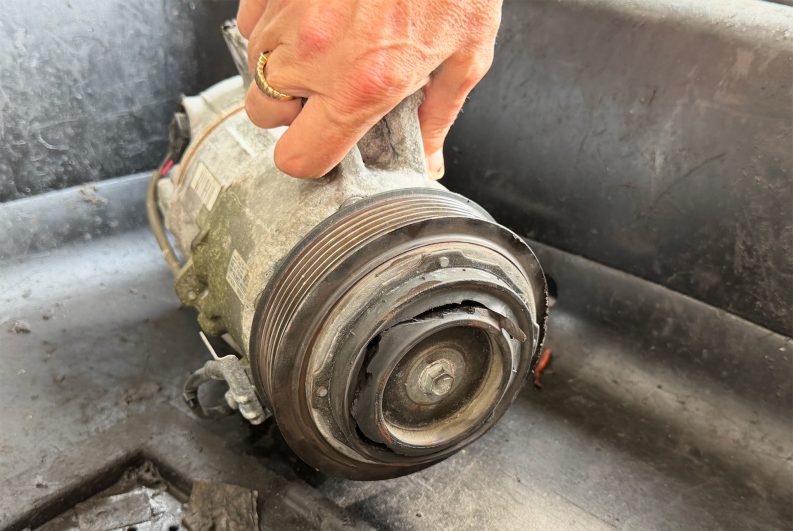 Locked up AC compressor.